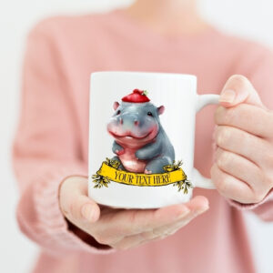 Ceramic Christmas mug featuring a cartoon baby hippo wearing a red Santa hat, ideal for festive holiday beverages