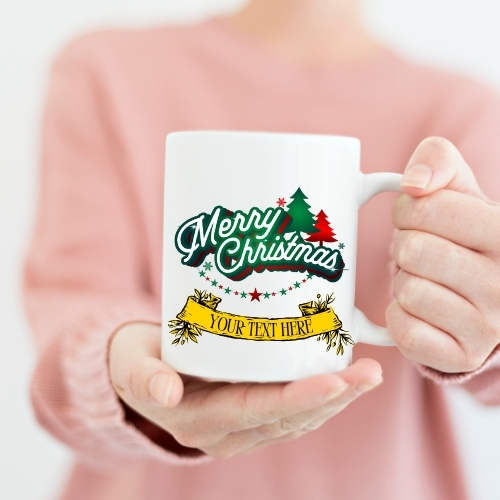 Ceramic Christmas mug featuring vibrant 'Merry Christmas' text in red, green, and gold colors, perfect for holiday beverages
